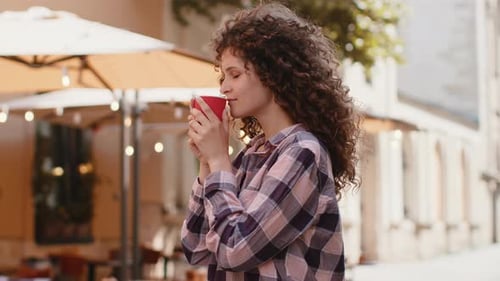Young Woman Girl Enjoying Drinking Morning Coffee Hot Drink Relaxing Taking a Break in City Street