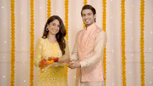 Joyful Couple Celebrating Diwali with Festive Decorations