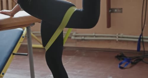 Woman Training Glute Doing Leg Raises