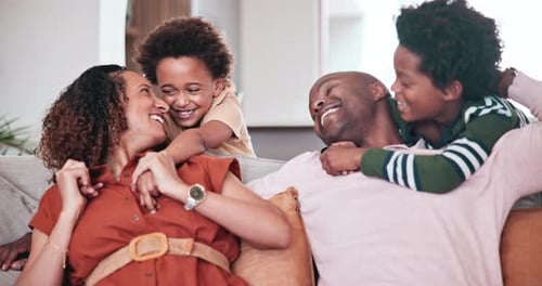 Loving Family Embracing and Laughing Together at Home