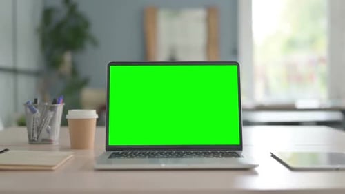 Laptop with Green Screen on Desk in Office, Chroma Key