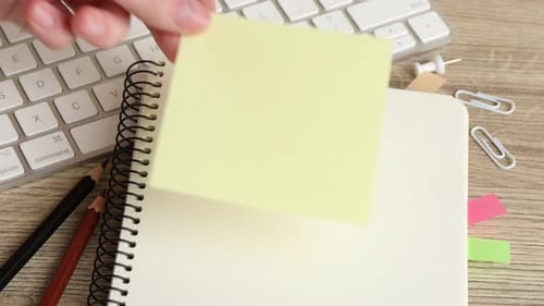Yellow Sticky Note on a Spiral Notebook