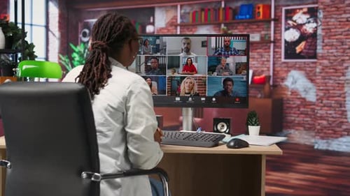 Remote Employee in Home Office Saluting Colleagues During Online Videocall