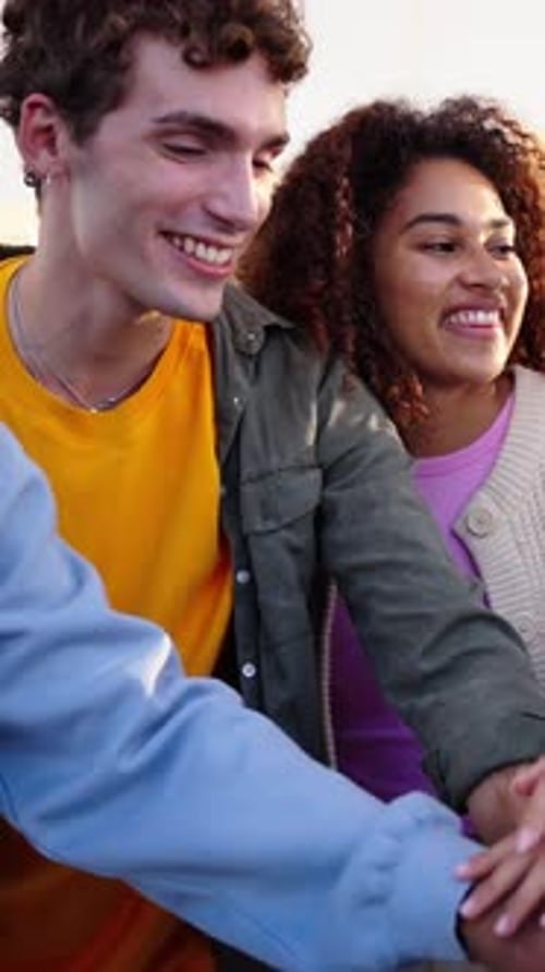 Diverse Group Friends Raise Hands Together in Unity