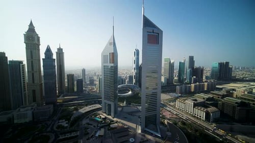 Aerial view of Dubai skyline with Emirates Towers, UAE.