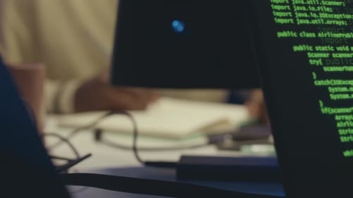 Java Script Code Running on Laptop in Dark Office