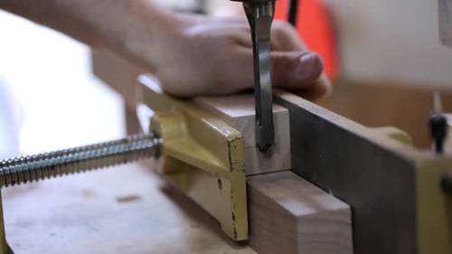 Close Up of Carpenter Clamping Wood Block with Vise 3539 Years