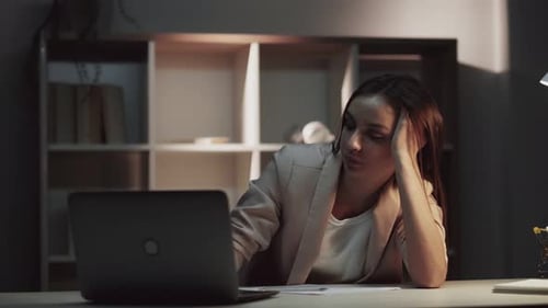 Tired Woman Working Late at Desk
