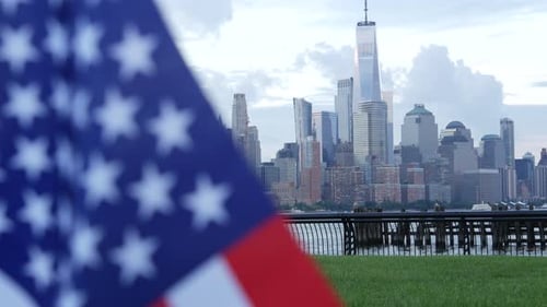 NYC Skyline with American Flag in Foreground
