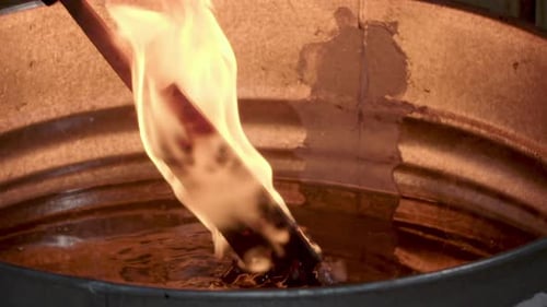Metal Stick Ignites in Liquid