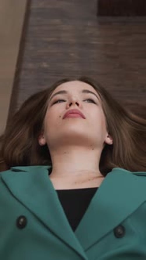 Woman Lying on Floor Looking Upward