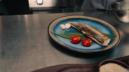 Chef Garnish Plate with Grilled Mackerel Fish
