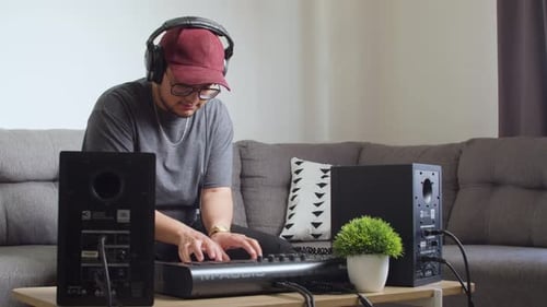 Young Adult Plays Electronic Keyboard at Home