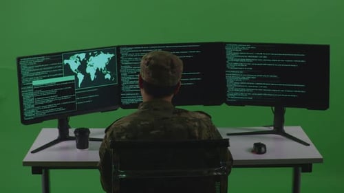 Tired Asian Man Soldier Developer Yawning While Write Code With Multiple Screens In Green Screen