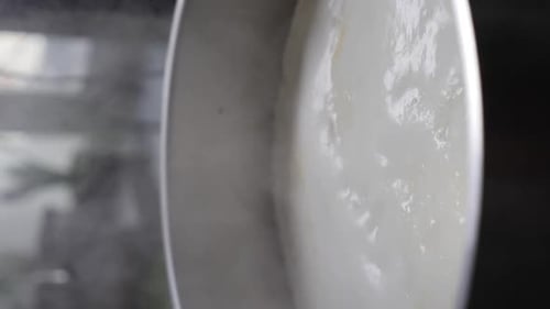 Closeup View of Hot Water Boiling in Steel Saucepan in Restaurant Kitchen Vertical Footage Slow
