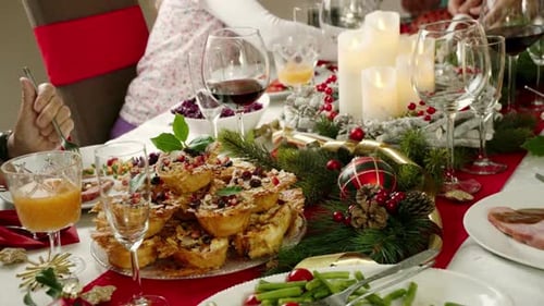 Family Celebrates Christmas Dinner at Home with Food
