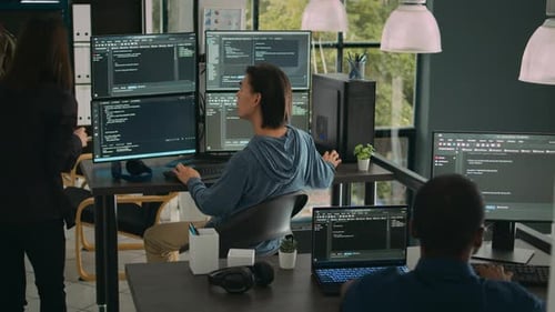 Team of Young Adults Working on Computers in Office