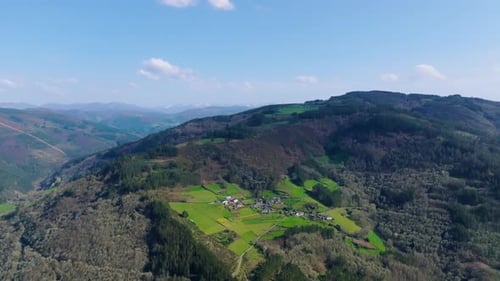 Village In The Mountain Surrounded By Forest In Fonsagrada, Lugo, Galicia, Spain. - aerial shot