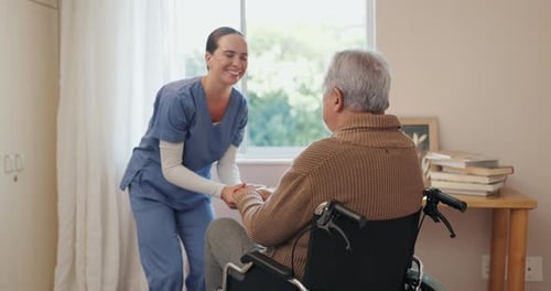 Caring Woman Holding Hands of Elderly Man
