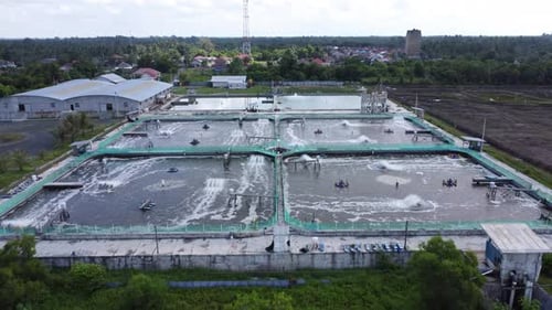 Aerial view of water circulation in a shrimp pond located on the beach
