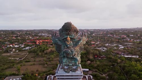 Majestic drone footage of Garuda Wisnu Kencana statue standing tall over southern Bali’s landscape