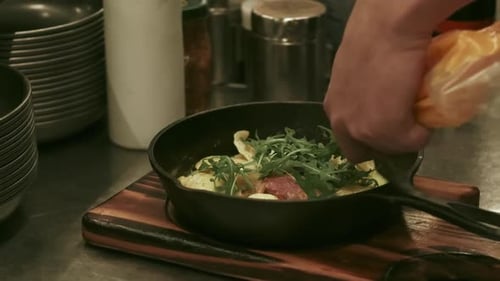 Chef Preparing a Tasty Meal in Kitchen