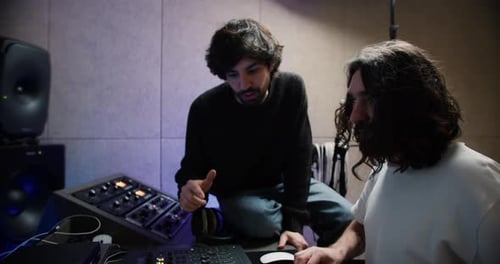 Harmonious Collaboration Singer and Sound Operator Crafting New Music