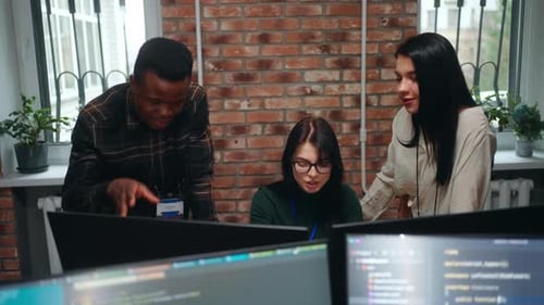 Active Discussion of Team of Web Developers of Designers in Office Multiethnic Man and Women