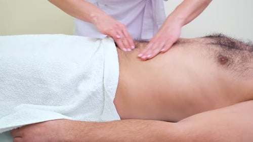 Man Receiving Abdomen Massage