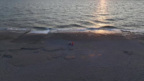 Aerial Video Golden Sunset Rays Reflecting on the Ocean with Stunning Textured Water