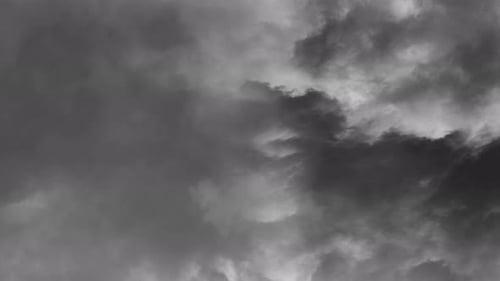 thunderstorms and lightning strikes within the gray cloudsthunderstorms and lightning strikes within