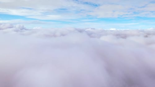 White Fluffy Clouds Against Blue Sky Aerial View
