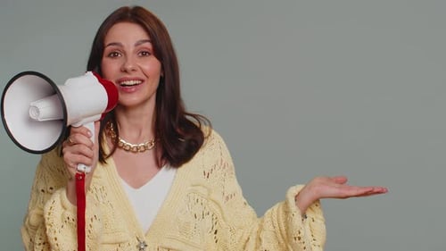 Woman Talking with Megaphone Proclaiming News Loudly Announcing Advertisement Pointing Empty Place