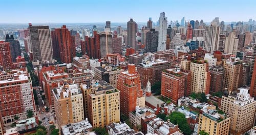 Colorful bright cityscape of New York. Drone footage above the metropolis panorama at daytime.