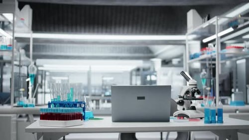 Microscope, Laptop, and Test Tubes in Modern Laboratory