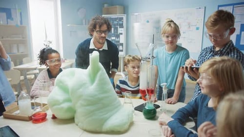 Elementary School Science / Chemistry Classroom: Enthusiastic Teacher Shows Funny Chemical Reaction