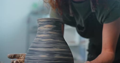 Woman Working Clay on Pottery Wheel, Close Up