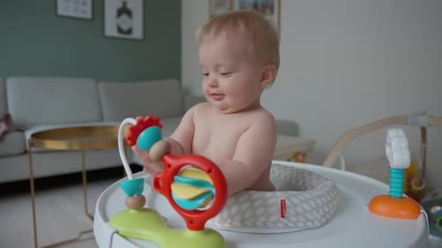 Baby Playing On A Baby Walker