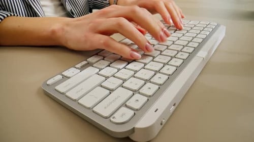 Closeup Female Young Hands Typing and Pressing a Button on a White Office Device Keyboard Nude