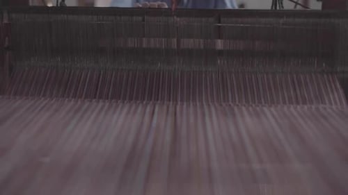 Vintage Weaving Machine Creating Textiles