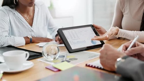 Tablet, analytics and graphs, business people in meeting with finance statistics