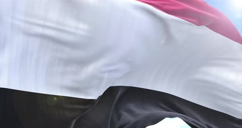 Realistic Waving Flag Animation with Blue Sky Background Loop