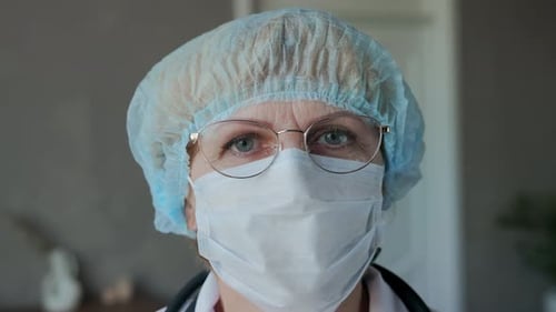 Close Up of Medical Professional with Mask and Glasses