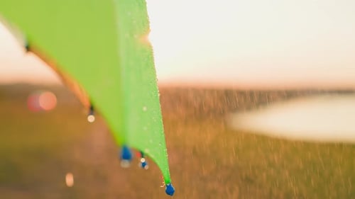 Close Up Shot of Tent in Rain at Sunset