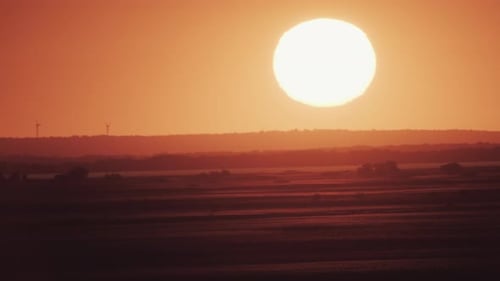 Big Sun at Sunset Without Clouds