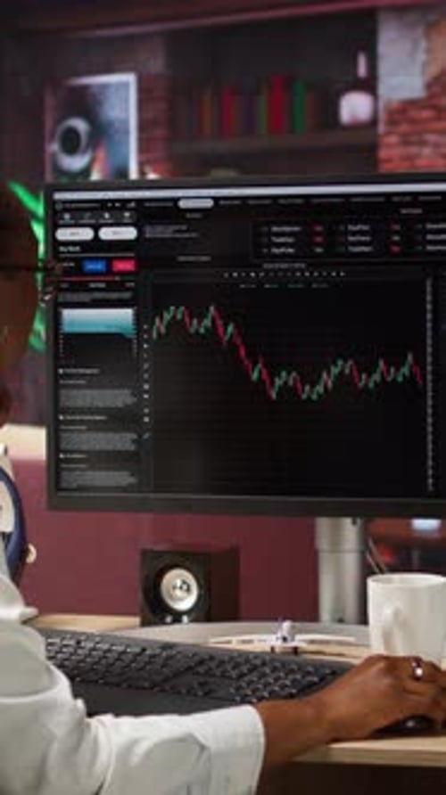 Woman Analyzes Financial Data at Home Office