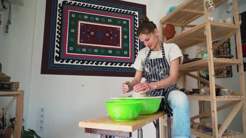 Woman Working With Clay in Pottery Studio
