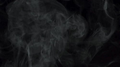 Abstract Smoke Billowing Against Black Background