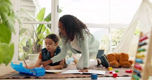 Two Children Drawing Indoors with Toys and Teepee