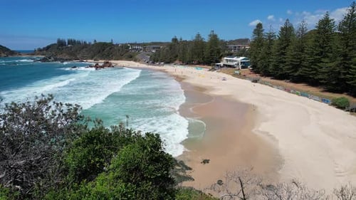 Flynns Beach With Beachfront Cafe In Port NSW, Australia. - aerial